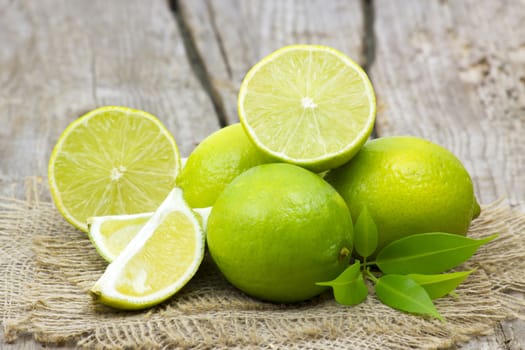 fresh lime fruits on wooden background