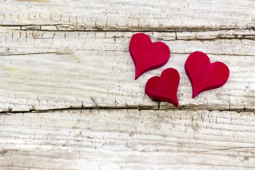 hearts on wooden background