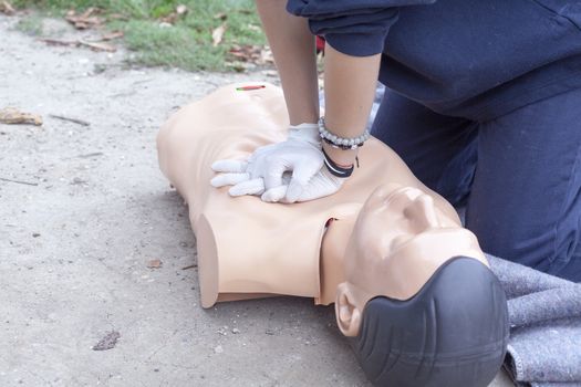 Paramedic practicing Cardiopulmonary resuscitation - CPR on a dummy