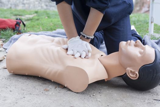 Paramedic practicing Cardiopulmonary resuscitation - CPR on a dummy