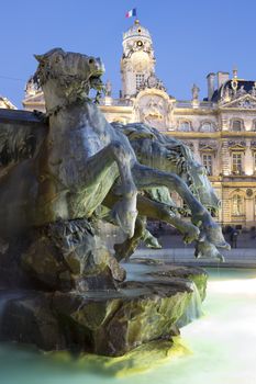 Vertical view of Bartholdi Fountain in Lyon by night, France