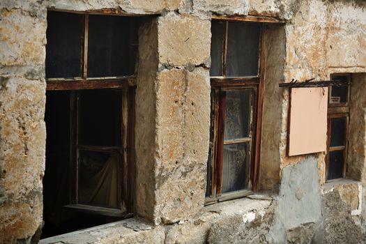 Windows of the old abandoned house. Horizontal photo