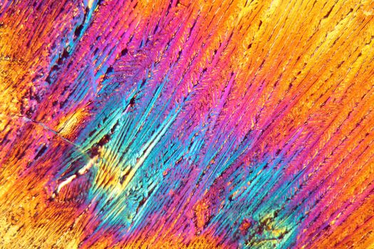 Cystein is a semi-essential amino acid which occurs in the human body. The photo is made with a magnification of 100x and in polarized light. The sample is pure Cystein chloride precipitated from a solution on a microscope slide.