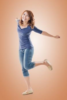 Excited Asian young girl, full length portrait isolated.