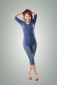 Excited Asian young girl, full length portrait isolated.