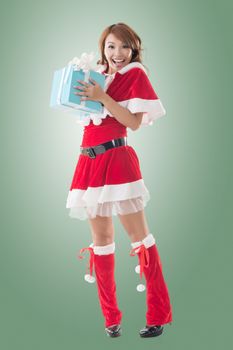 Smile happy Asian Christmas girl hold gift box, isolated full length portrait.