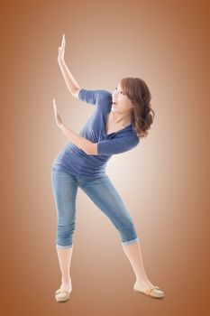 Full length portrait of Asian woman under stress, isolated on studio background.