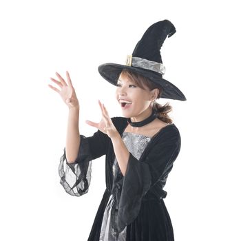 Asian witch woman using magic, closeup portrait with copyspace.