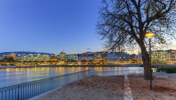 GENEVA, SWITZERLAND - NOVEMBER 13, 2014 : Geneva riverside from Rousseau island by night, Switzerland, HDR