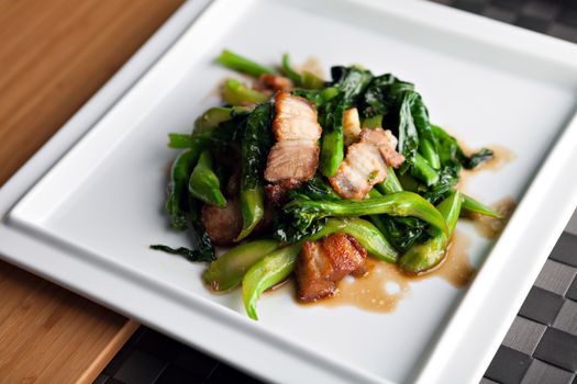 Thai style crispy pork dish with Chinese broccoli.