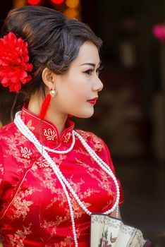 Chinese woman red dress traditional cheongsam ,close up portrait