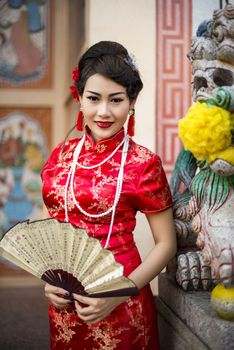 Chinese woman red dress traditional cheongsam ,close up portrait 