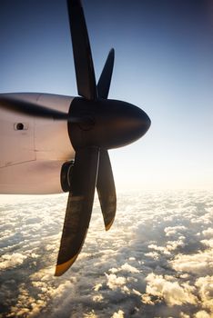 Defocused and blurred image Airplane propeller engine against on sky