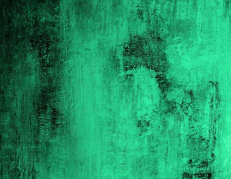 Green and Black Cracked Obsolete Cement Wall Background closeup