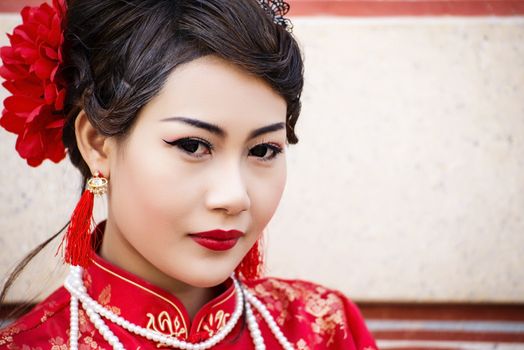 Chinese woman red dress traditional cheongsam ,close up portrait