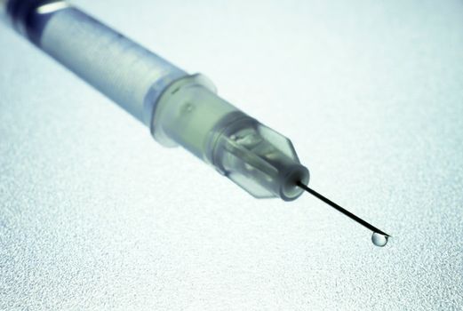 insulin syringe with a drop. Selective focus. Diabetes concept