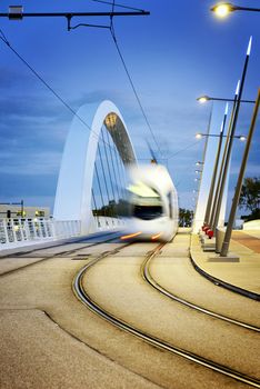 Lyon city near confluence district with tramway on the bridge, France