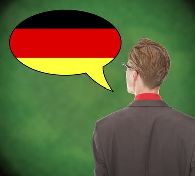 Young business man speaking german on school board background