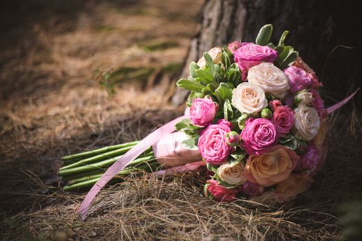 wedding bouquet from different rose color roses