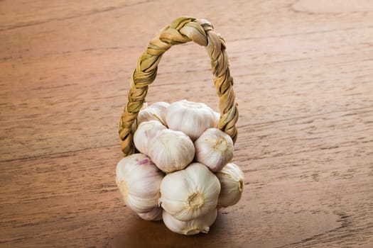 Organic garlic on wood table