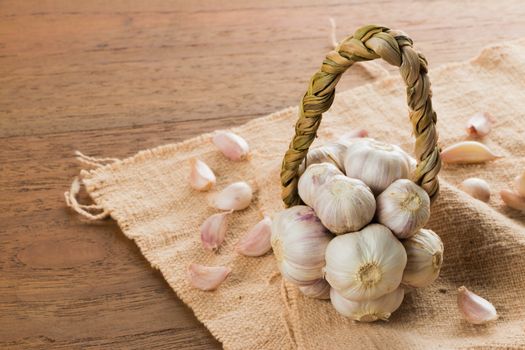 Organic garlic on wood table