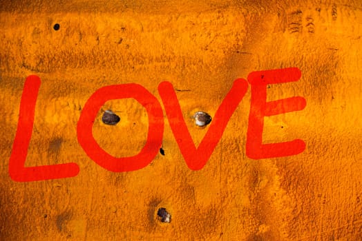 RED Word LOVE (uppercase) on old Containers background