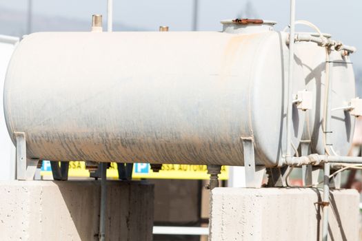 Water tank off the ground on concrete supports