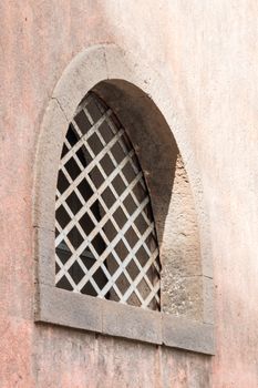 Ancient window with protective metal burglar-proof