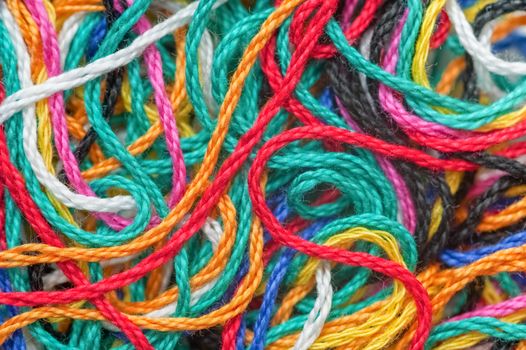 macro background of multi-colored needlecraft embroidery threads
