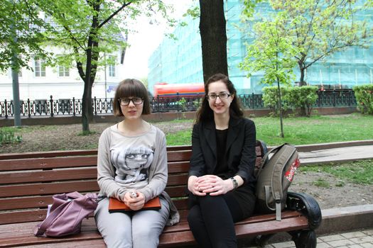 Moscow, Russia - May 8, 2012. Protesting against violations on elections the opposition occupied the square tease a monument to the poet to Abay, this movement received the name of Okkupay Abay. The politician Vera Kichanova and the unknown in the boulevard near a venue of an oppositional action