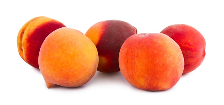 Fresh peaches isolated on a white background