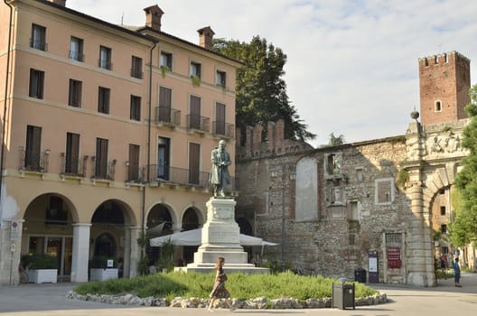 The entrance to the Olympic theater in Vicenza, Italy  from Square Matteotti. The medieval wall predates the theatre, but the rusticated entrance arch was designed by Scamozzi.
