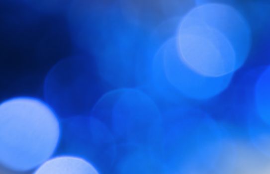 Blue lights blur circles abstract christmas background.