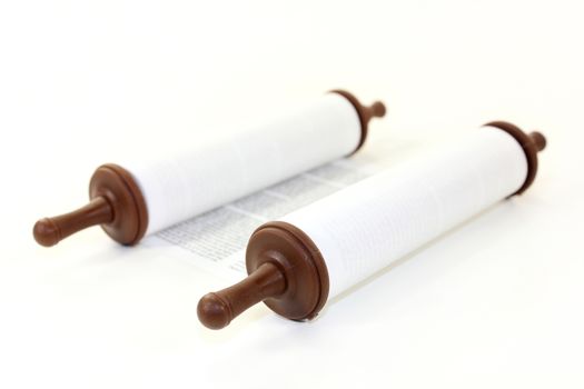 a Torah scroll in front of white background