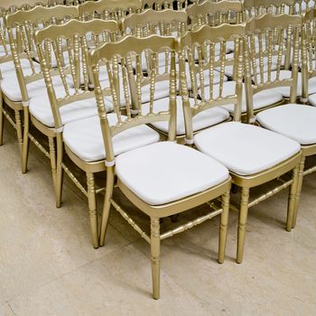 Rows of gold chairs - meeting background