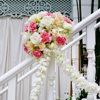 Beautiful wedding flower decoration at stairs