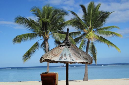 Stand, sun, sea, palm beach chair. So one imagines a tax haven.