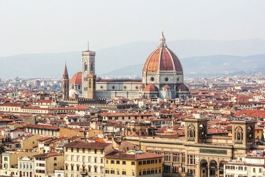 View of the city of Florence from Piazzale Michelangelo with focus on Duomo or cathedral Santa Maria del Fiore and Giotto's Campanile.