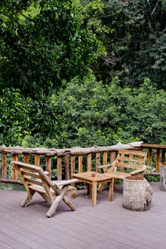 Outdoor bench and view of forest