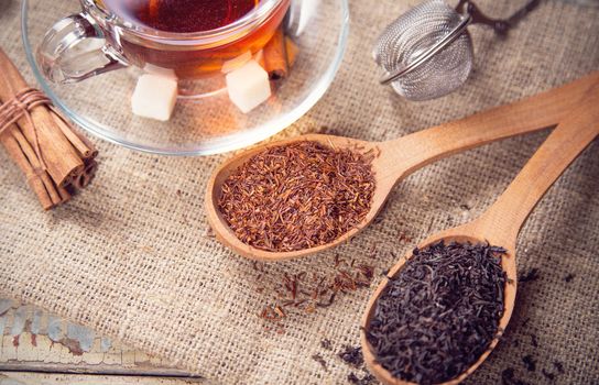 dry tea is in wooden spoons, in a studio