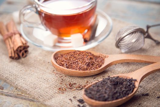 dry tea is in wooden spoons, in a studio