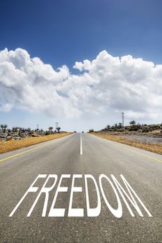 Image of a road with the text FREEDOM