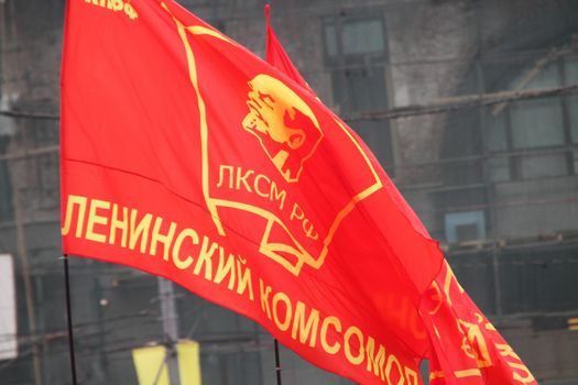 Moscow, Russia - May 9, 2012. March of communists on the Victory Day. Flag of Komsomol during procession of communists