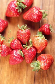 heap red ripe,fresh strawberry on a wooden background