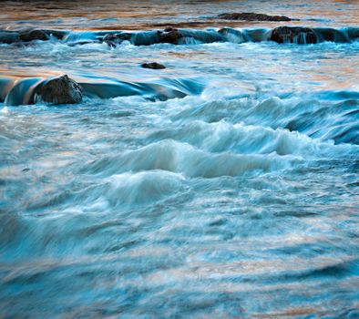 background evening wild river with white ripples