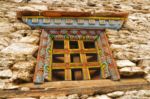 Traditional decorated window on old stone nepalese house