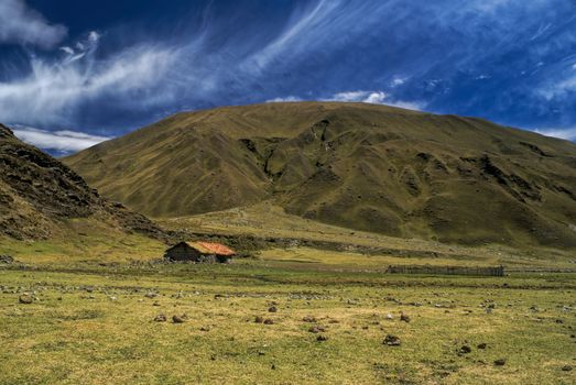Picturesque green valley in between hills of Peruvian Andes