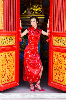 Woman in red dress,Cheongsam dress of Chinese traditional.