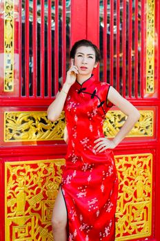 Woman in red dress,Cheongsam dress of Chinese traditional.