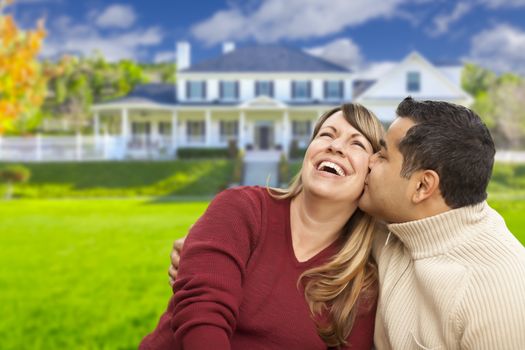 Happy Mixed Race Couple in Front of Beautiful House.